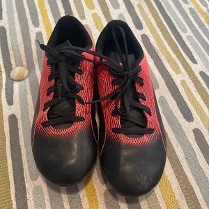 Youth puma soccer cleats. Red and black size 2